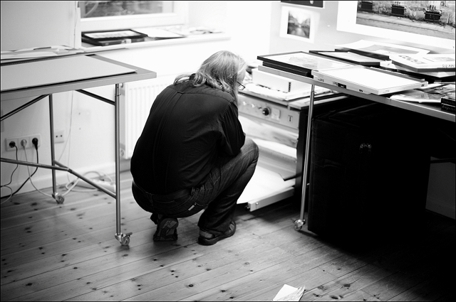 Harf Zimmermann checking a dried baryta print in his studio
